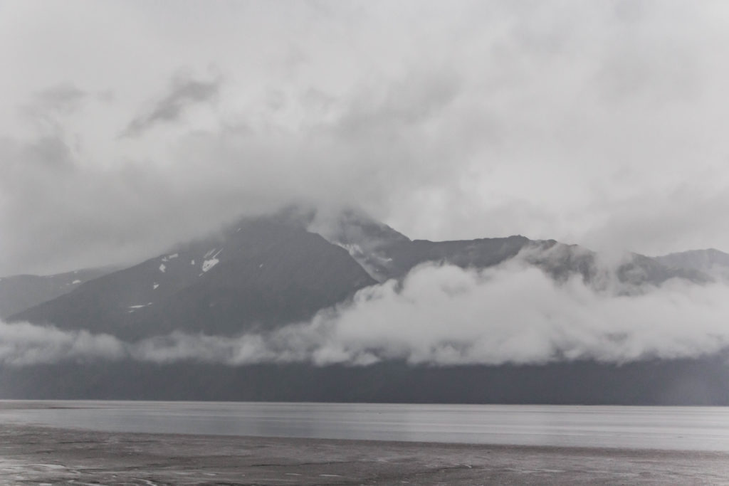 Cloudy mountains with lake on seward highway alaska