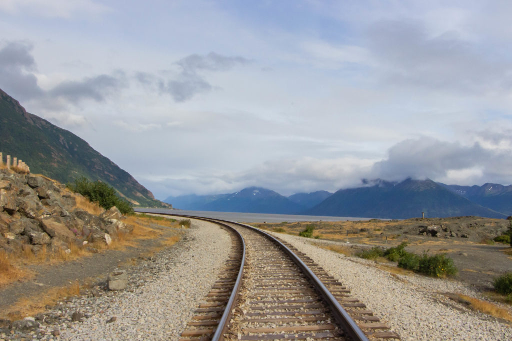Railroad tracks in alaska turnigan arm seward highway with mountains
